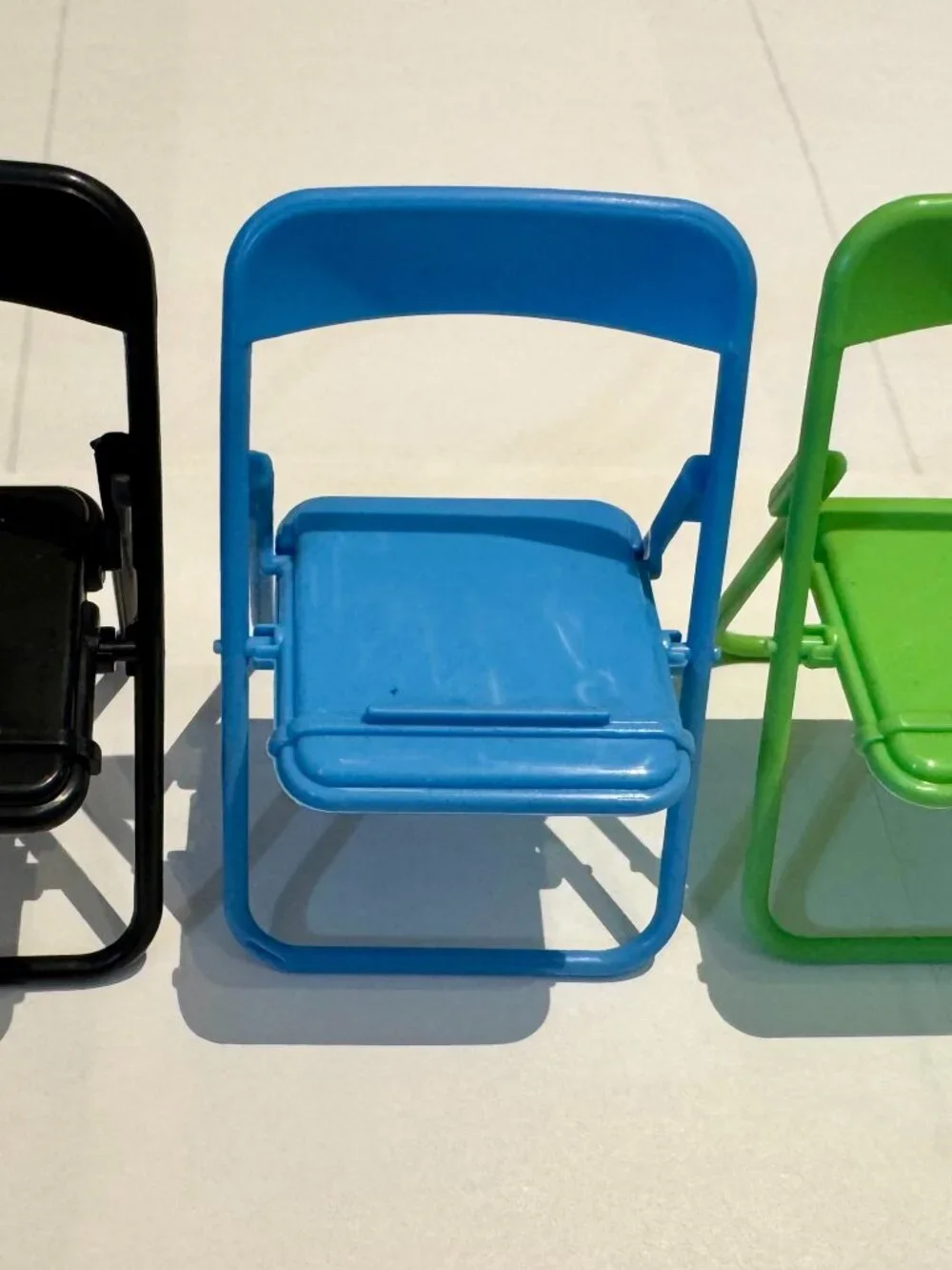 Black Plastic Folding Chair Cell Phone Stand